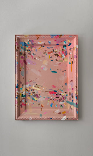 Decorative tray with colorful abstract design on a gray background